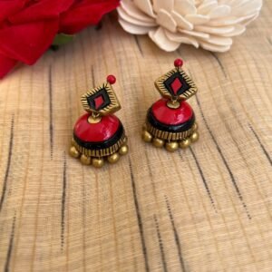 Small red and black terracotta jhumkas with diamond studs