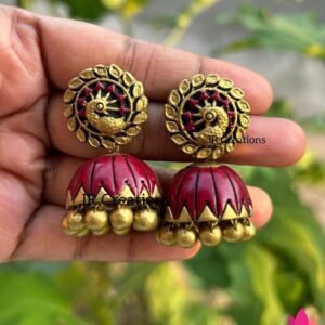 Maroon terracotta jhumkas with gold peacock studs